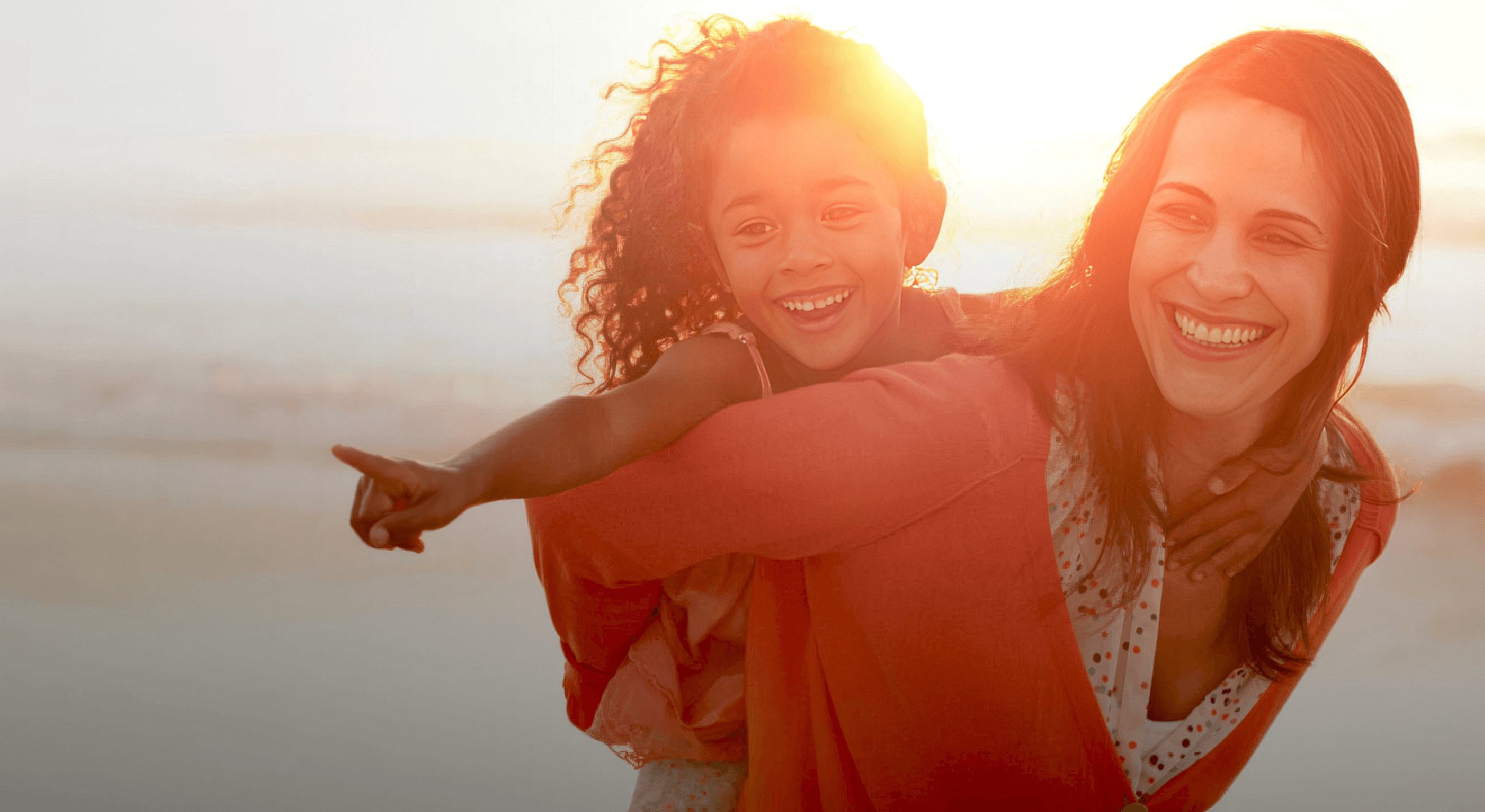 Woman and her daughter on a beach