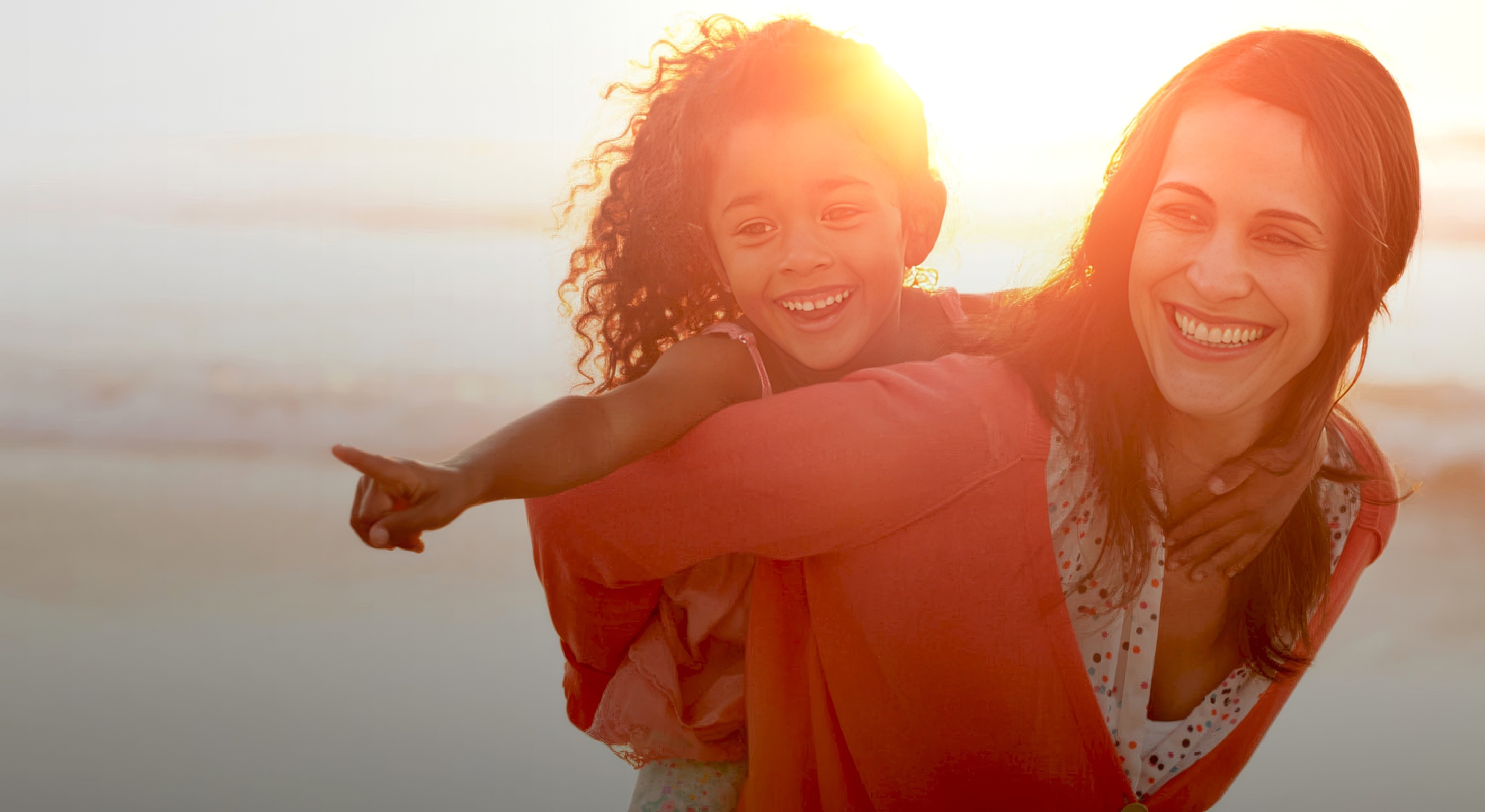 Woman and her daughter on a beach