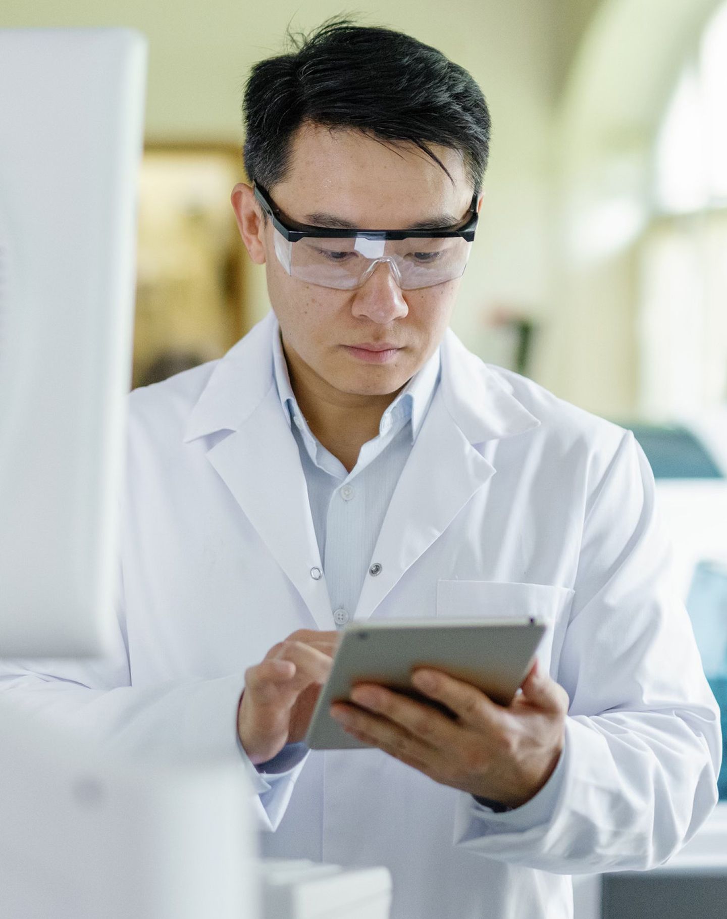 Scientist looking at an ipad